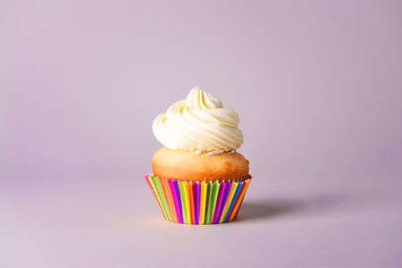 Tasty Birthday cupcake on gray backgroundの写真素材