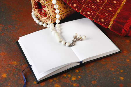 Muslim prayer mat, beads and Koran on grunge backgroundの写真素材
