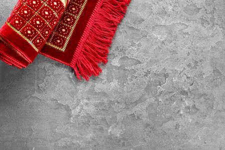 Muslim prayer mat on gray backgroundの写真素材