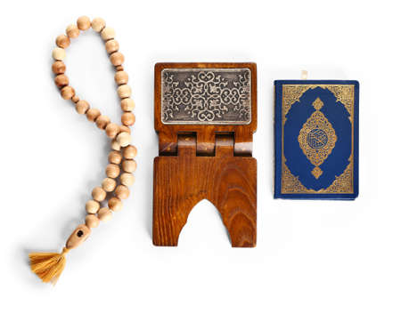 Muslim beads, rehal and Koran on white backgroundの写真素材