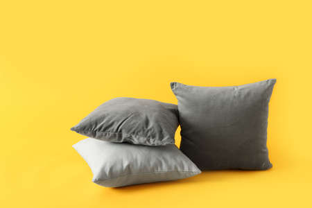 Soft pillows on color backgroundの写真素材