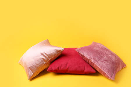 Soft pillows on color backgroundの写真素材