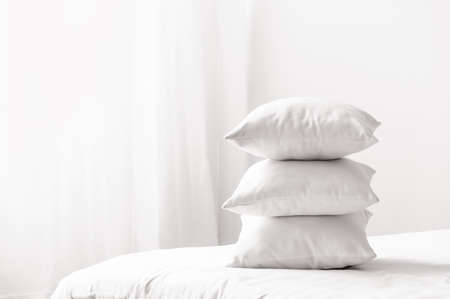 Soft pillows on cozy bed