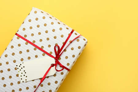 Beautiful gift box on color background