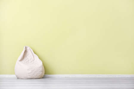Comfortable beanbag near color wallの写真素材