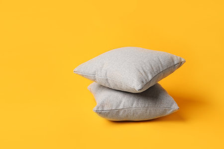 Soft pillows on color backgroundの写真素材