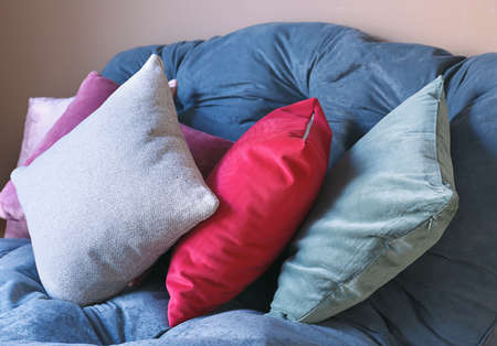 Soft pillows on color sofa