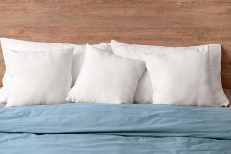 Cozy bed with soft pillows