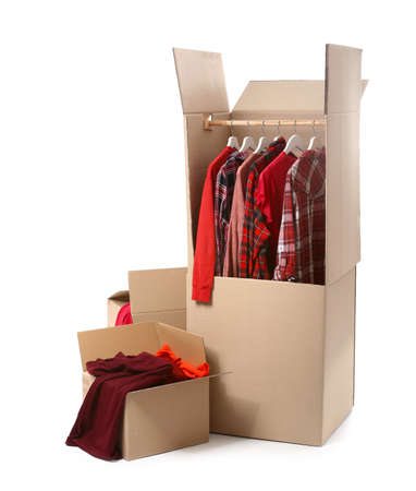 Wardrobe boxes with clothes on white backgroundの写真素材