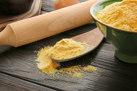Corn flour on wooden table