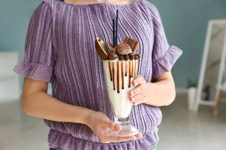 Young woman with delicious freak shake, closeupの写真素材