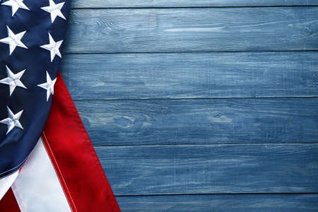 Flag of the United States of America on wooden background. Independence Day celebration