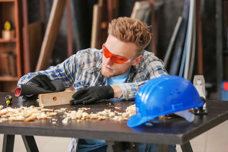 Male carpenter working in shopの写真素材
