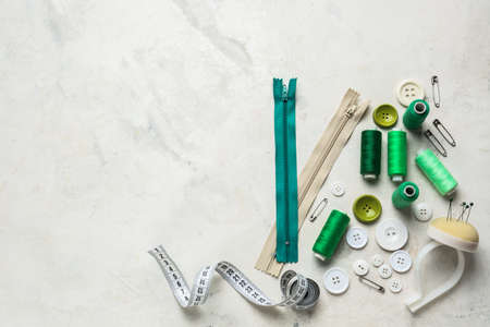 Set of sewing threads and accessories on light backgroundの写真素材