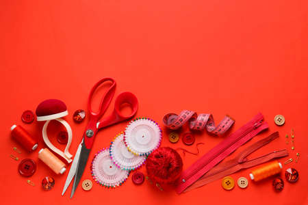 Set of sewing threads and accessories on color backgroundの写真素材