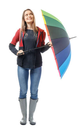 Beautiful young woman with umbrella on white backgroundの写真素材