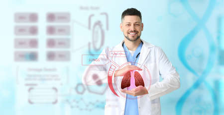 Male doctor using virtual screen with picture of lungs on color backgroundの写真素材