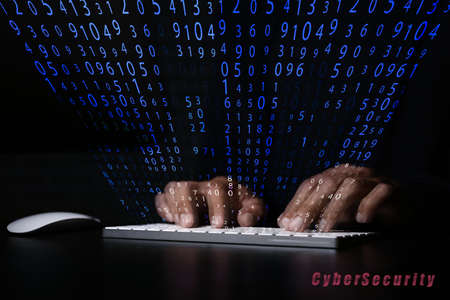 Male programmer with computer keyboard creating software for data protection