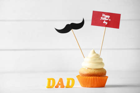 Tasty cupcake for Father's Day on white backgroundの写真素材