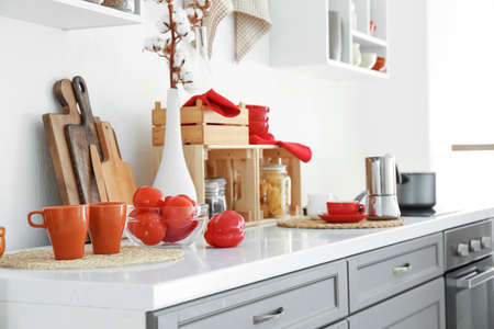 Counter with products and utensils in interior of modern kitchenの写真素材