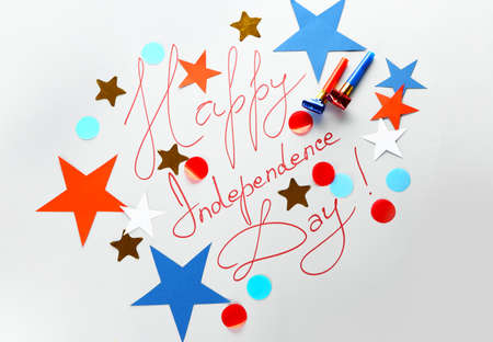 Text HAPPY INDEPENDENCE DAY with confetti on light background