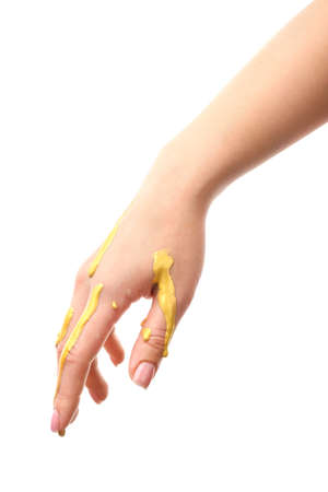 Female hand with paint on white backgroundの写真素材