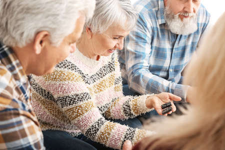 Happy senior people spending time together in nursing homeの写真素材
