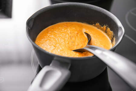 Cooking of delicious cream soup on electric stove