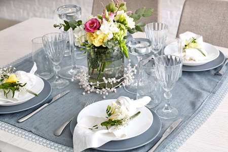 Beautiful table setting with fresh freesia flowers