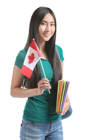 Asian student with Canadian flag on white backgroundの写真素材