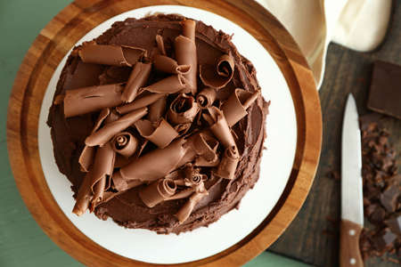 Tasty chocolate cake on table