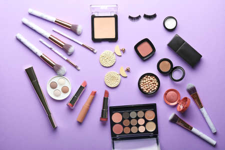Set of decorative cosmetics and accessories on color backgroundの写真素材