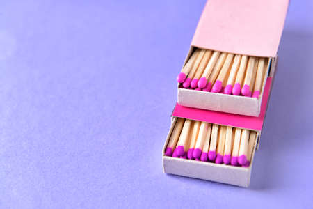 Boxes with matches on color backgroundの写真素材