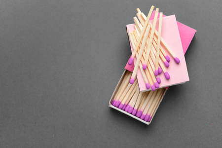 Boxes with matches on gray backgroundの写真素材
