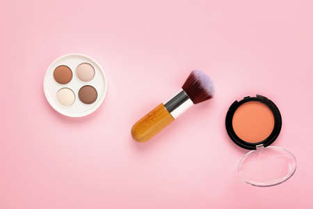 Decorative cosmetics and brush on color backgroundの写真素材
