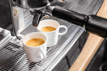 Modern coffee machine making coffee