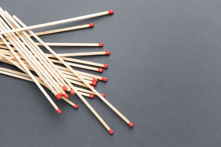 Many fireplace matches on gray backgroundの写真素材