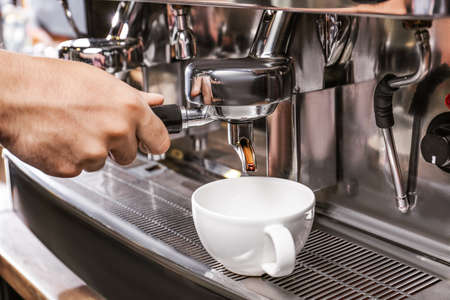 Barista preparing fresh aromatic coffee in cafe, closeupの写真素材