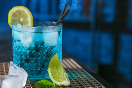 Glass of Blue  cocktail on table in barの写真素材