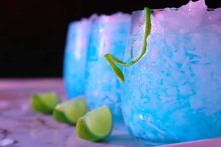 Glasses of Blue cocktail on table, closeup
