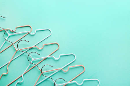 Many clothes hangers on color backgroundの写真素材