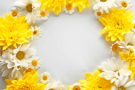 Frame made of beautiful flowers on white backgroundの写真素材