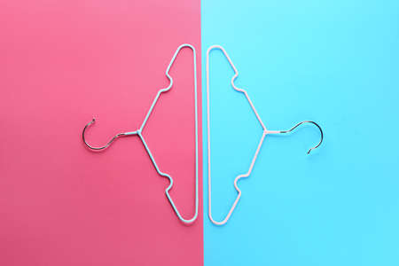 Clothes hangers on color backgroundの写真素材