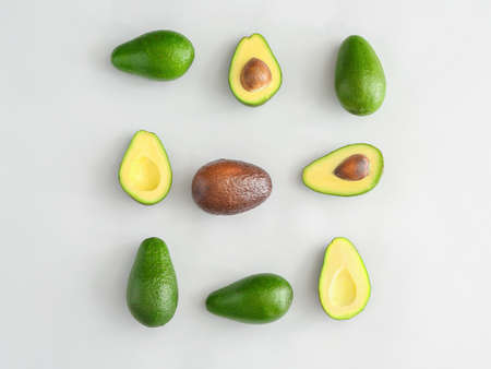 Fresh ripe avocados on white background