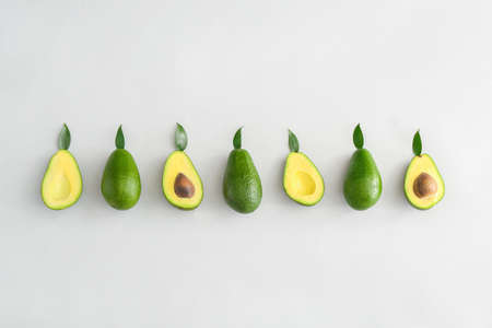 Fresh ripe avocados on white backgroundの写真素材