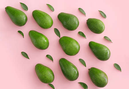 Fresh ripe avocados on color backgroundの写真素材