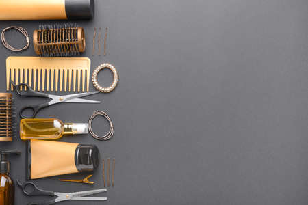 Set of hairdresser tools and accessories on dark backgroundの写真素材