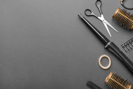 Set of hairdresser tools and accessories on dark backgroundの写真素材
