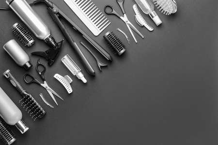 Set of hairdresser tools and accessories on dark backgroundの写真素材