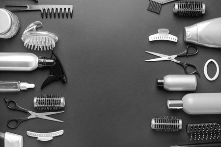 Set of hairdresser tools and accessories on dark backgroundの写真素材